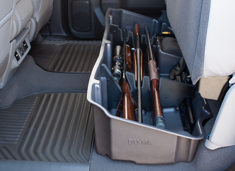 This DU-HA will hold 2 shotguns or rifles, 1 with scope, in the upright position and acts as a legal gun case in most states with the seats in the down position.